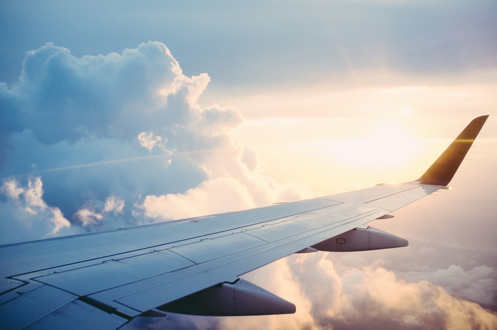 Air travel above the clouds representing VIP journeys